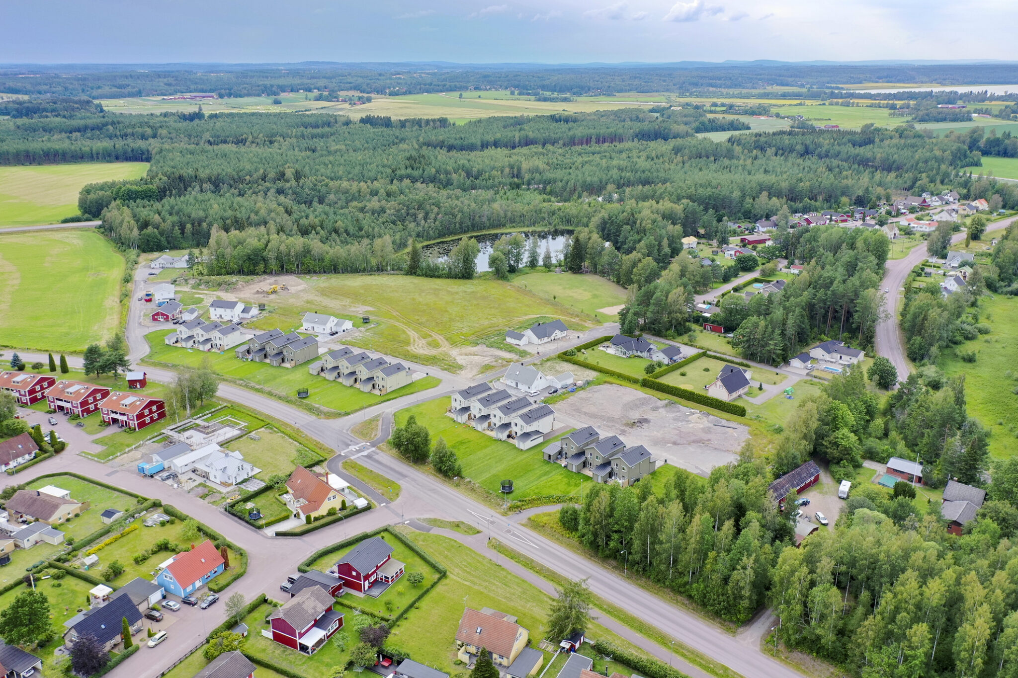 Residential houses surrounded by green landscape